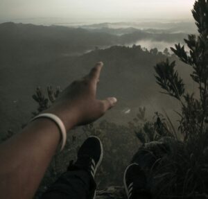 someone pointing to the horizon