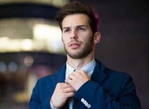 student tightening tie and looking professional