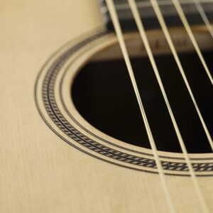 A rosette surrounding the sound hole of an acoustic guitar.