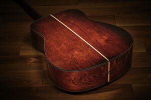 The back of an acoustic guitar.