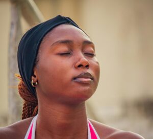 close up of someone breathing and meditating 