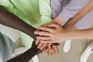stacked hands showing teamwork
