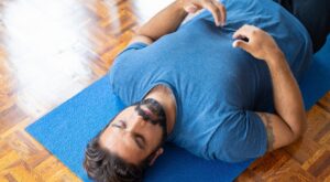 man doing yoga deep breathing