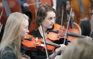 two violin players during rehearsal