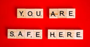 letter tiles spelling out "you are safe here."